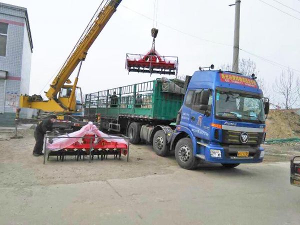 Machines loading into shipping containers